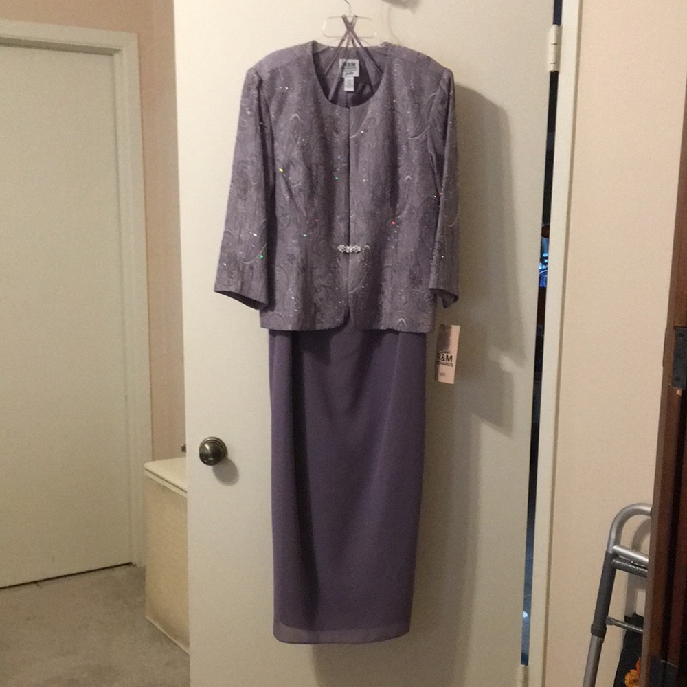 Formal sleeveless dress with jacket.
